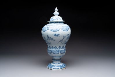 A blue and white Dutch Delft baluster vase and cover with birds among flowering branches, late 17th C.