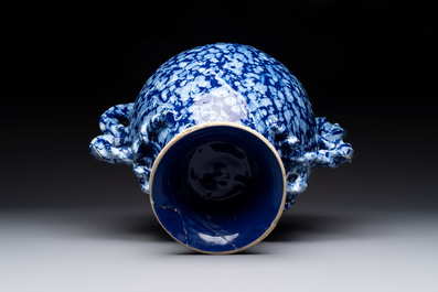 A rare large Nevers white-splashed blue-ground rope twist handled vase with '&agrave; la bougie' decor, France, 17th C.