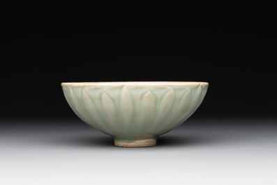 A Chinese Longquan celadon 'lotus' bowl and a large green-glazed Shiwan jar, Ming and later