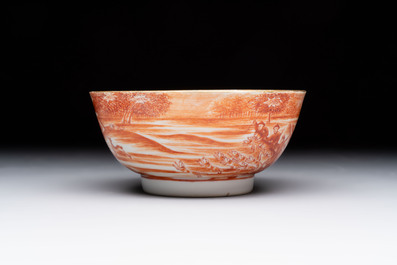 A Chinese iron-red-decorated 'Deer Hunting' bowl and two cups, Qianlong
