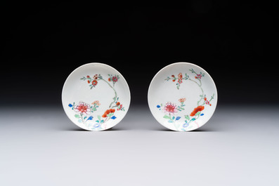 Seven Chinese famille rose cups and eleven saucers with floral design, Qianlong