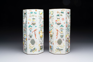 A pair of Chinese famille rose relief-moulded reticulated 'antiquities' hat stands, 19th C.