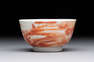 A Chinese iron-red-decorated 'Deer Hunting' cup and saucer, Qianlong