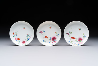 Seven Chinese famille rose cups and eleven saucers with floral design, Qianlong