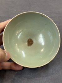 A Chinese Longquan celadon 'lotus' bowl and a large green-glazed Shiwan jar, Ming and later