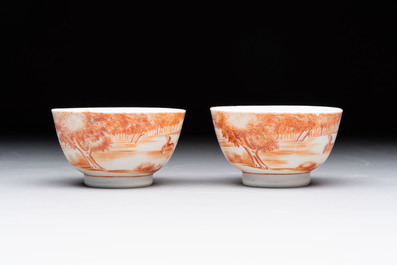 A Chinese iron-red-decorated 'Deer Hunting' bowl and two cups, Qianlong