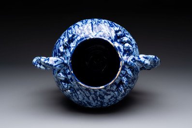 A rare large Nevers white-splashed blue-ground rope twist handled vase with '&agrave; la bougie' decor, France, 17th C.