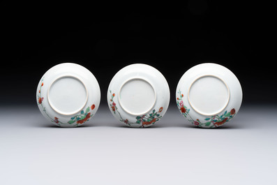 Seven Chinese famille rose cups and eleven saucers with floral design, Qianlong