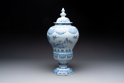 A blue and white Dutch Delft baluster vase and cover with birds among flowering branches, late 17th C.
