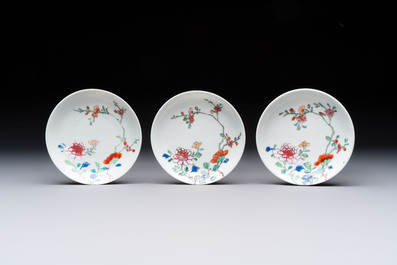 Seven Chinese famille rose cups and eleven saucers with floral design, Qianlong