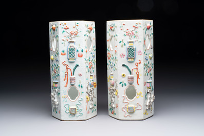 A pair of Chinese famille rose relief-moulded reticulated 'antiquities' hat stands, 19th C.