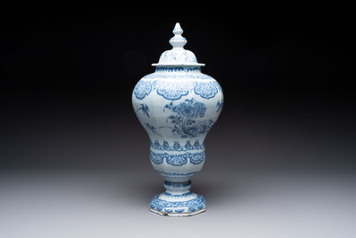 A blue and white Dutch Delft baluster vase and cover with birds among flowering branches, late 17th C.