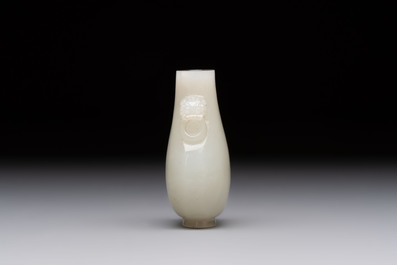A Chinese white jade snuff bottle with lion-form handles, 19th C.