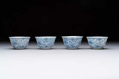 Ten Chinese blue and white cups and eleven saucers, Kangxi