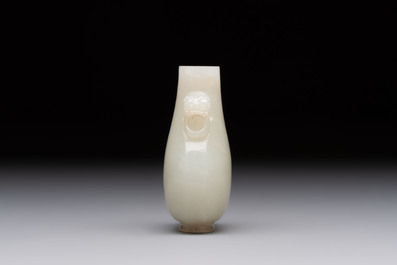 A Chinese white jade snuff bottle with lion-form handles, 19th C.