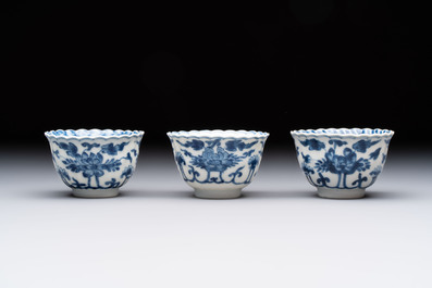 A set of six Chinese blue and white cups and saucers with floral design, Kangxi