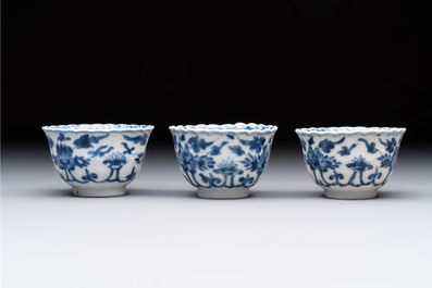 A set of six Chinese blue and white cups and saucers with floral design, Kangxi