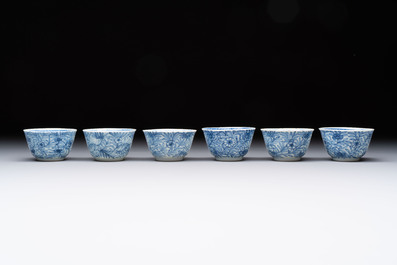 Ten Chinese blue and white cups and eleven saucers, Kangxi