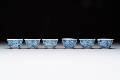 Ten Chinese blue and white cups and eleven saucers, Kangxi