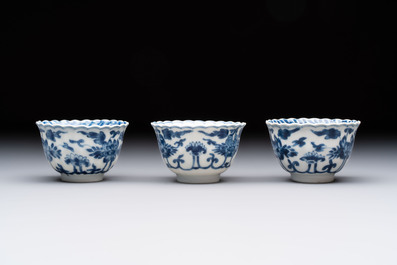 A set of six Chinese blue and white cups and saucers with floral design, Kangxi