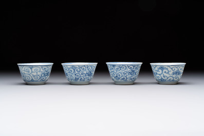 Ten Chinese blue and white cups and eleven saucers, Kangxi