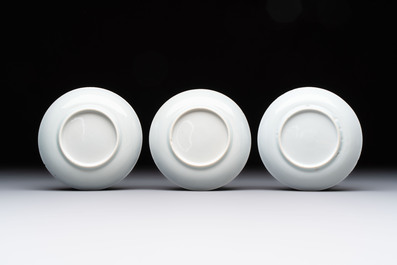 Ten Chinese blue and white cups and eleven saucers, Kangxi