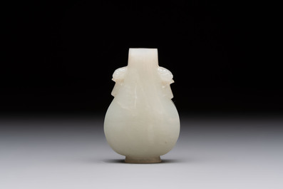A Chinese white jade snuff bottle with lion-form handles, 19th C.