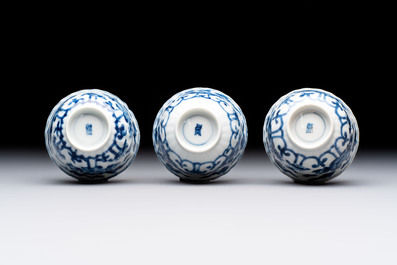 A set of six Chinese blue and white cups and saucers with floral design, Kangxi