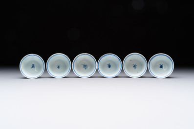 Ten Chinese blue and white cups and eleven saucers, Kangxi