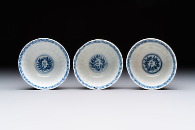 A set of six Chinese blue and white cups and saucers with floral design, Kangxi