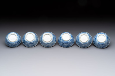 Ten Chinese blue and white cups and eleven saucers, Kangxi