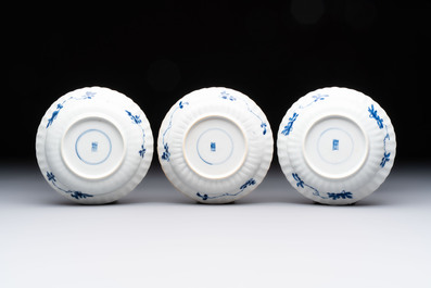 A set of six Chinese blue and white cups and saucers with floral design, Kangxi