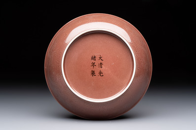 A Chinese copper-red-glazed incised 'dragon' plate, Guangxu mark and possibly of the period