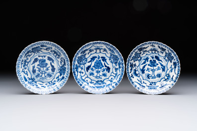 A set of six Chinese blue and white cups and saucers with floral design, Kangxi