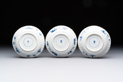 A set of six Chinese blue and white cups and saucers with floral design, Kangxi