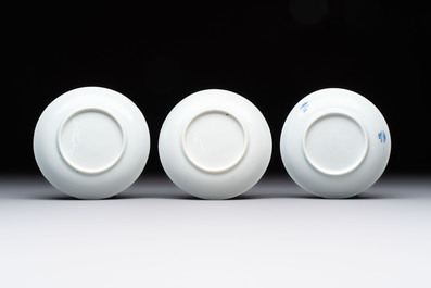 Ten Chinese blue and white cups and eleven saucers, Kangxi