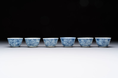 Ten Chinese blue and white cups and eleven saucers, Kangxi
