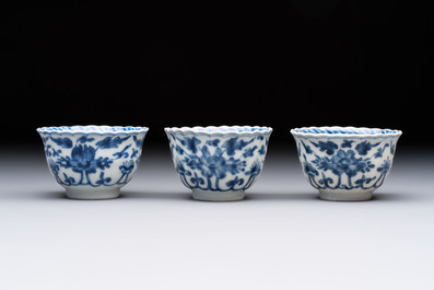 A set of six Chinese blue and white cups and saucers with floral design, Kangxi