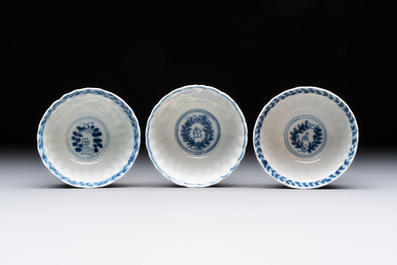 A set of six Chinese blue and white cups and saucers with floral design, Kangxi
