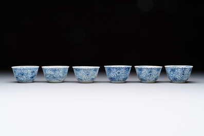 Ten Chinese blue and white cups and eleven saucers, Kangxi