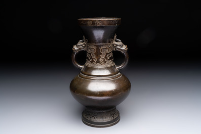 A Chinese archaistic bronze vase with 'mythical beast' handles, Yuan/Ming