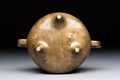 A Chinese bronze two-handled tripod censer, 19th C.