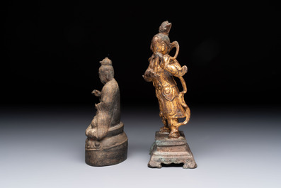 A Chinese bronze Taoist figure and a gilt-lacquered guardian, Ming