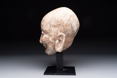 A Chinese sandstone head of a Luohan, Ming
