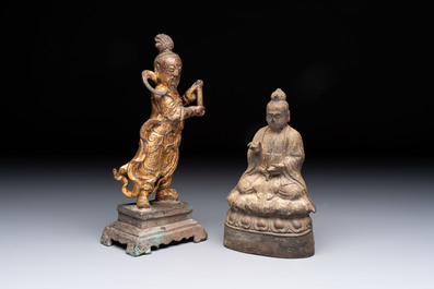 A Chinese bronze Taoist figure and a gilt-lacquered guardian, Ming