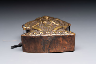 A Tibetan copper Gawu box and tsa tsa mold, 19th C.