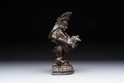 A Tibetan or Nepalese turquoise-inlaid partly-gilt bronze figure of White Tara and a figure of Makahala, 20th C.