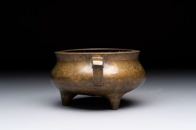 A Chinese bronze two-handled tripod censer, 19th C.