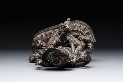 A Tibetan or Nepalese turquoise-inlaid partly-gilt bronze figure of White Tara and a figure of Makahala, 20th C.