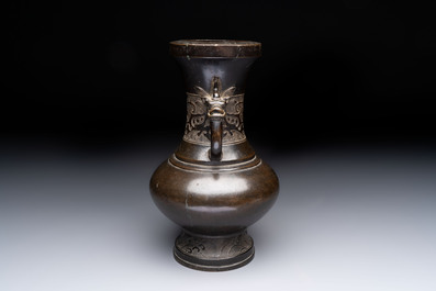 A Chinese archaistic bronze vase with 'mythical beast' handles, Yuan/Ming